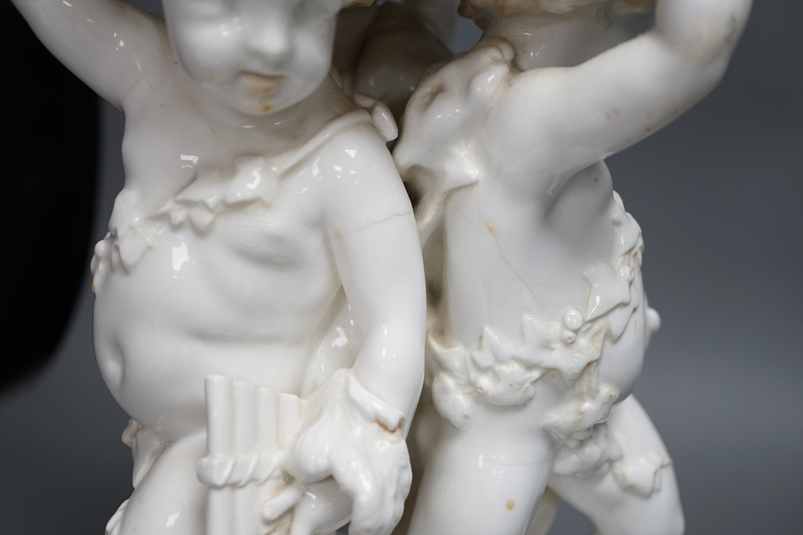 A Victorian English porcelain cherub centrepiece, now mounted as a lamp (restored), possibly Moore Bros., 71 cm height to top of lamp fitting